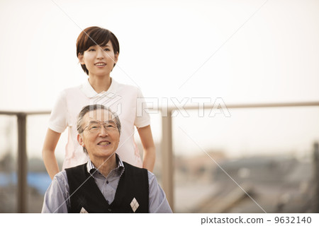 Wheelchair male and female caregiver 9632140