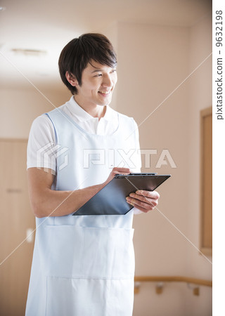 Male caregiver interviewing Male caregiver interviewing 9632198