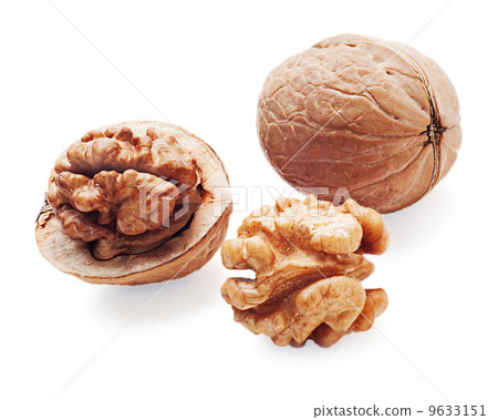 walnut and a cracked walnuts isolated on the white background walnut and a cracked walnuts isolated on the white background 9633151