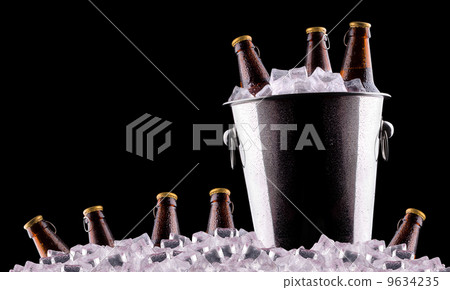 Beer bottles in ice bucket 9634235