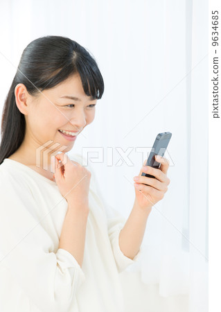 A woman using a mobile phone 9634685