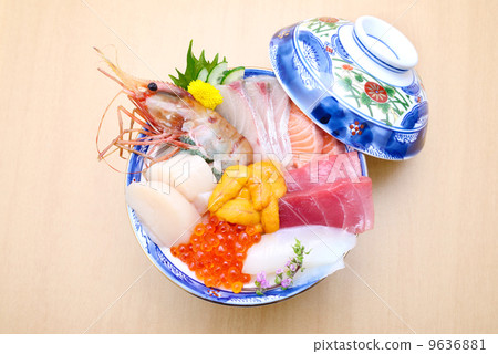 Bowl of rice topped with sashimi  9636881