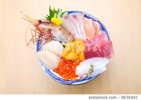 Bowl of rice topped with sashimi  9636882