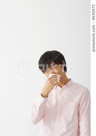 Male blowing nose 9636972