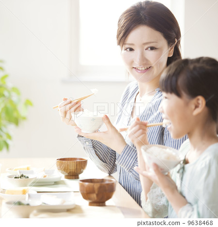 Parent and child eating breakfast Parent and child eating breakfast 9638468