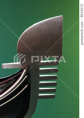 Tip of the famous romantic boat gondola in Venice 9639272