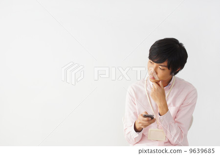 A man who feels a smartphone A man who feels a smartphone 9639685
