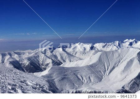 View on off-piste slopes and blue sky View on off-piste slopes and blue sky 9641373