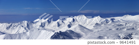 Panoramic view on off-piste slope and snowy plateau at nice day Panoramic view on off-piste slope and snowy plateau at nice day 9641491