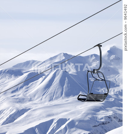 Chair lifts and off piste slope in fog Chair lifts and off piste slope in fog 9641492