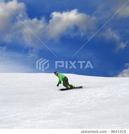 Snowboarder on ski slope 9641928