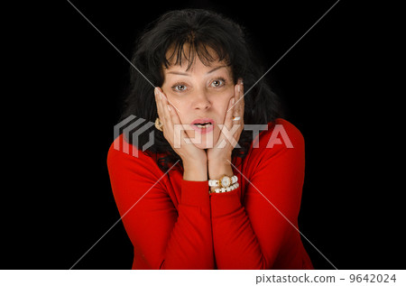 Astonished woman in red sweater 9642024