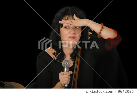 Singer looks having put a palm to forehead Singer looks having put a palm to forehead 9642025