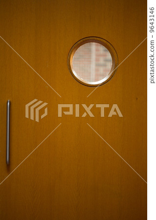 Detail shot of a closed wooden door 9643146