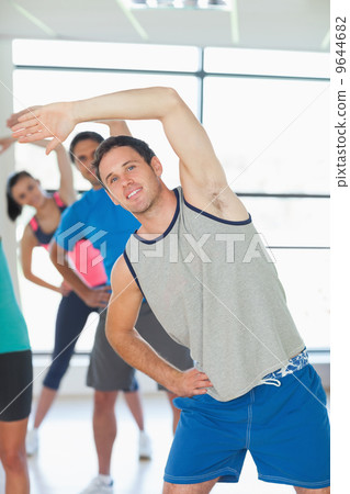 People doing power fitness exercise at yoga class People doing power fitness exercise at yoga class 9644682