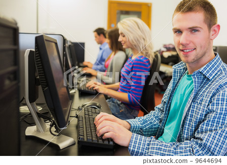 Students using computers in the computer room 9644694