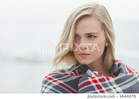 Close up of a young woman covered with blanket 9644879