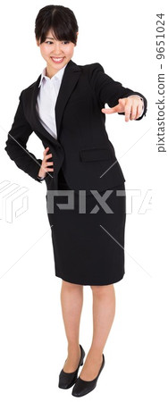 Smiling businesswoman pointing 9651024
