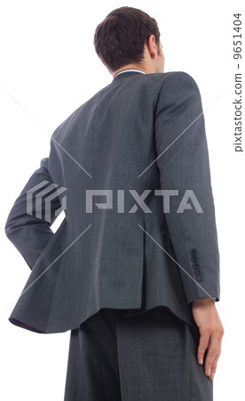 Businessman standing with hand on hip 9651404