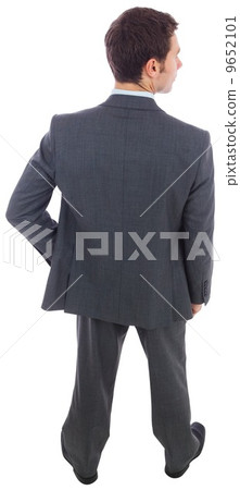 Businessman standing with hand on hip 9652101