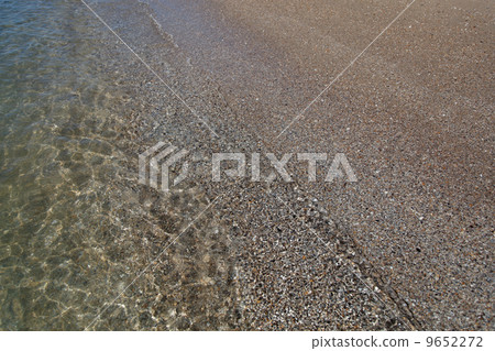 Soft wave of the sea on the sandy beach 9652272