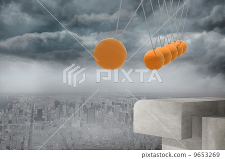 Newtons cradle above city 9653269