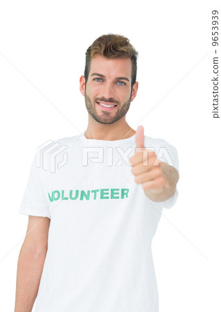 Portrait of a happy male volunteer gesturing thumbs up 9653939