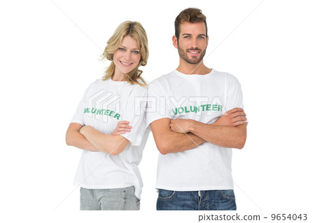 Portrait of two happy volunteers with hands crossed 9654043