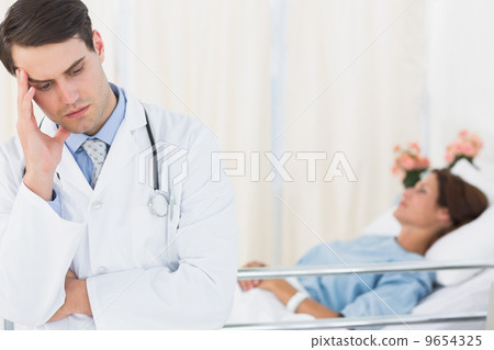 Worried doctor with patient in hospital 9654325