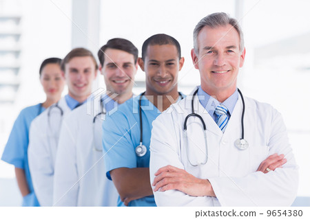 Doctors standing in a row at hospital 9654380