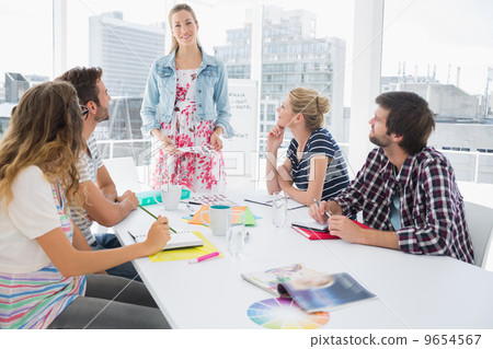Casual business people in office at presentation Casual business people in office at presentation 9654567