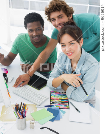 Portrait of three smiling artists at the office Portrait of three smiling artists at the office 9656014