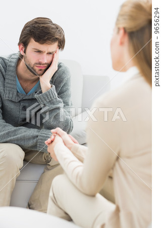 Man in meeting with a financial adviser Man in meeting with a financial adviser 9656294
