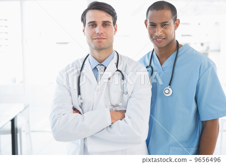 Confident doctors standing together in the hospital Confident doctors standing together in the hospital 9656496