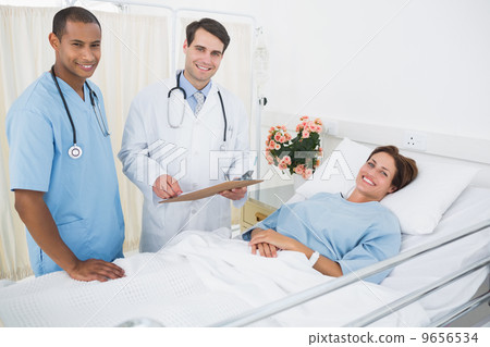 Doctor and surgeon visiting patient in hospital Doctor and surgeon visiting patient in hospital 9656534