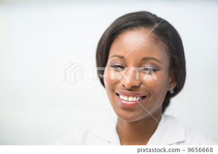 Happy nurse smiling at camera Happy nurse smiling at camera 9656668