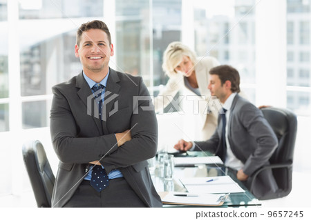 Businessman with colleagues discussing in office Businessman with colleagues discussing in office 9657245