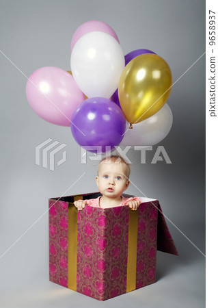cute little girl sitting on box with balloons cute little girl sitting on box with balloons 9658937