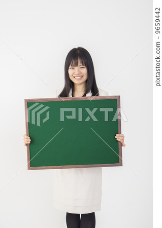 A business woman with a blackboard 9659442
