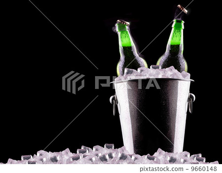 Beer bottles in ice bucket Beer bottles in ice bucket 9660148