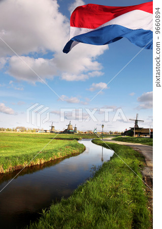 Traditional Dutch windmills with canal in Zaanse Schans near the Amsterdam, Holland 9660894