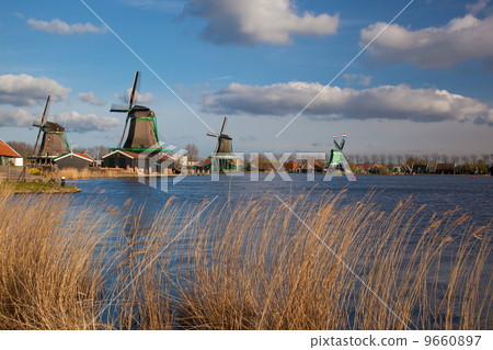 Traditional Dutch windmills with canal in Zaanse Schans near the Amsterdam, Holland Traditional Dutch windmills with canal in Zaanse Schans near the Amsterdam, Holland 9660897