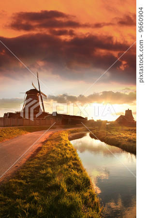 Traditional Dutch windmills with canal in Zaanse Schans near the Amsterdam, Holland Traditional Dutch windmills with canal in Zaanse Schans near the Amsterdam, Holland 9660904