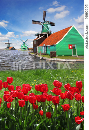 Traditional Dutch windmills with canal in Zaanse Schans near the Amsterdam, Holland 9660905