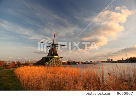 Traditional Dutch windmills with canal in Zaanse Schans near the Amsterdam, Holland 9660907