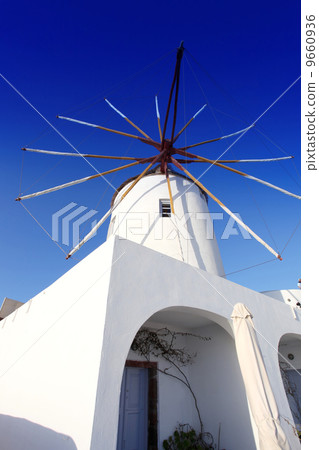 Santorini island with windmills in Greece Santorini island with windmills in Greece 9660936