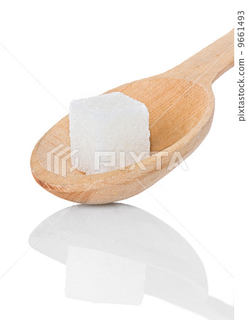 refining sugar cube in spoon 9661493