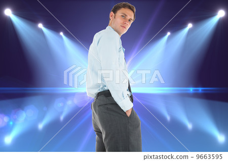 Composite image of serious businessman standing with hands in po Composite image of serious businessman standing with hands in po 9663595
