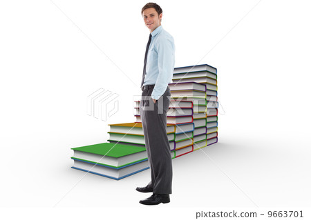 Composite image of smiling businessman standing with hands in po 9663701