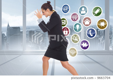 Composite image of angry businesswoman gesturing 9663704